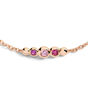 Gioiello bracciale Bollicine in oro rosa con pietre preziose colorate, simbolo di eleganza e stile vivace.